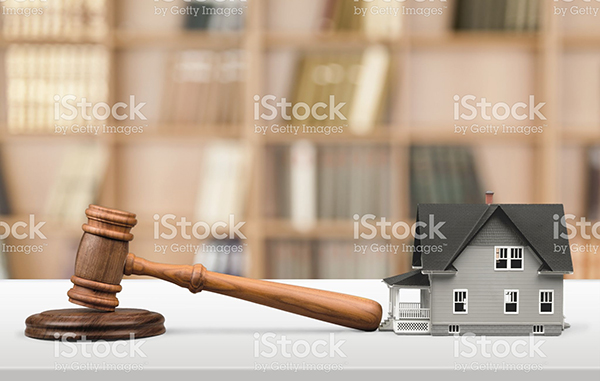 Gavel with a small house